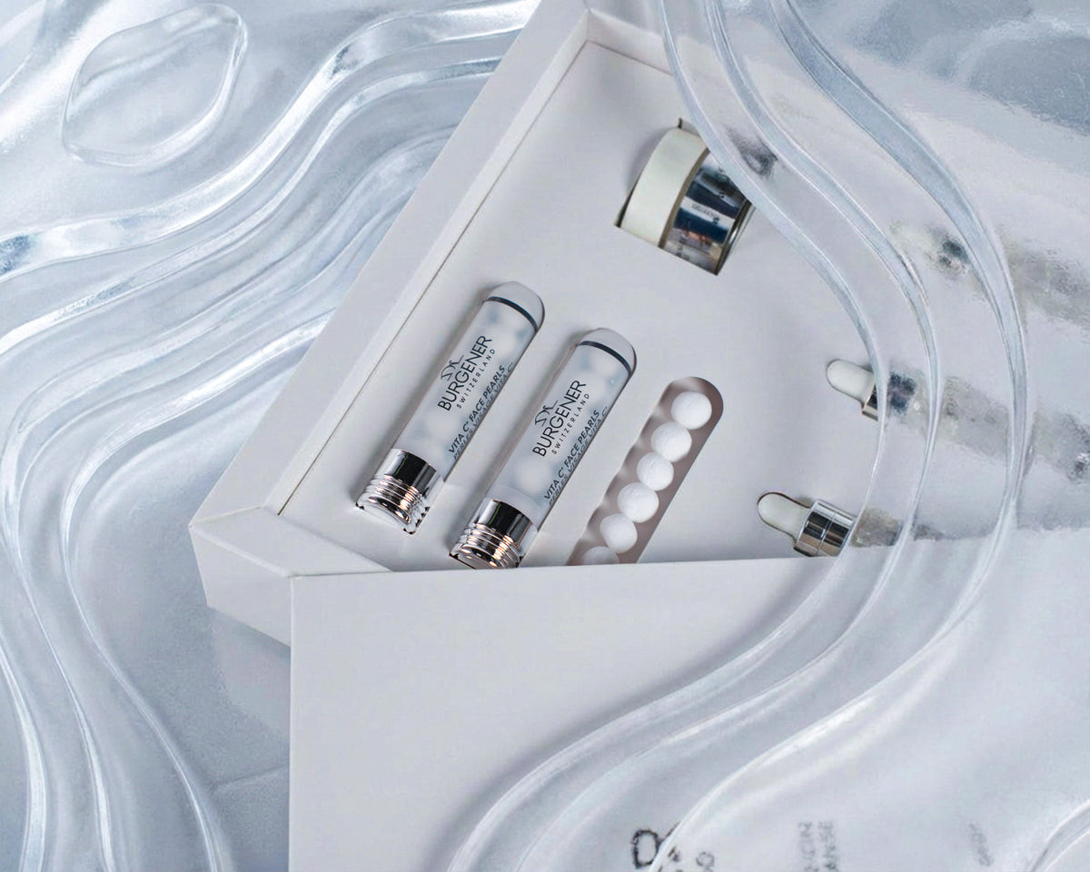 Dr Burgener Switzerland Skincare product set with ampoules and a box on a light background