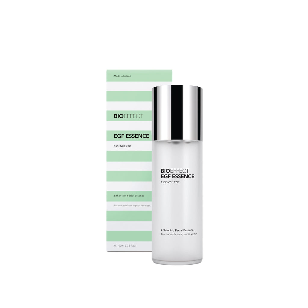 BIOEFFECT EGF ESSENCE Enhancing Facial Essence shown as a white bottle with a reflective silver cap next to its light green and white striped packaging box on a white background.