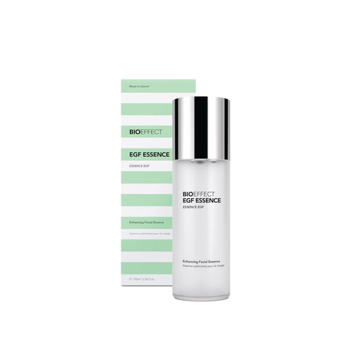 BIOEFFECT EGF ESSENCE Enhancing Facial Essence shown as a white bottle with a reflective silver cap next to its light green and white striped packaging box on a white background.