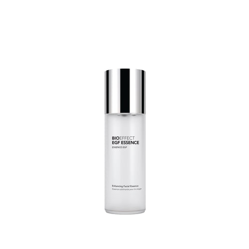 A clear cylindrical skincare bottle with a reflective silver cap, labeled 'BIOEFFECT BGF ESSENCE ENHANCE BGF' on a plain white background.