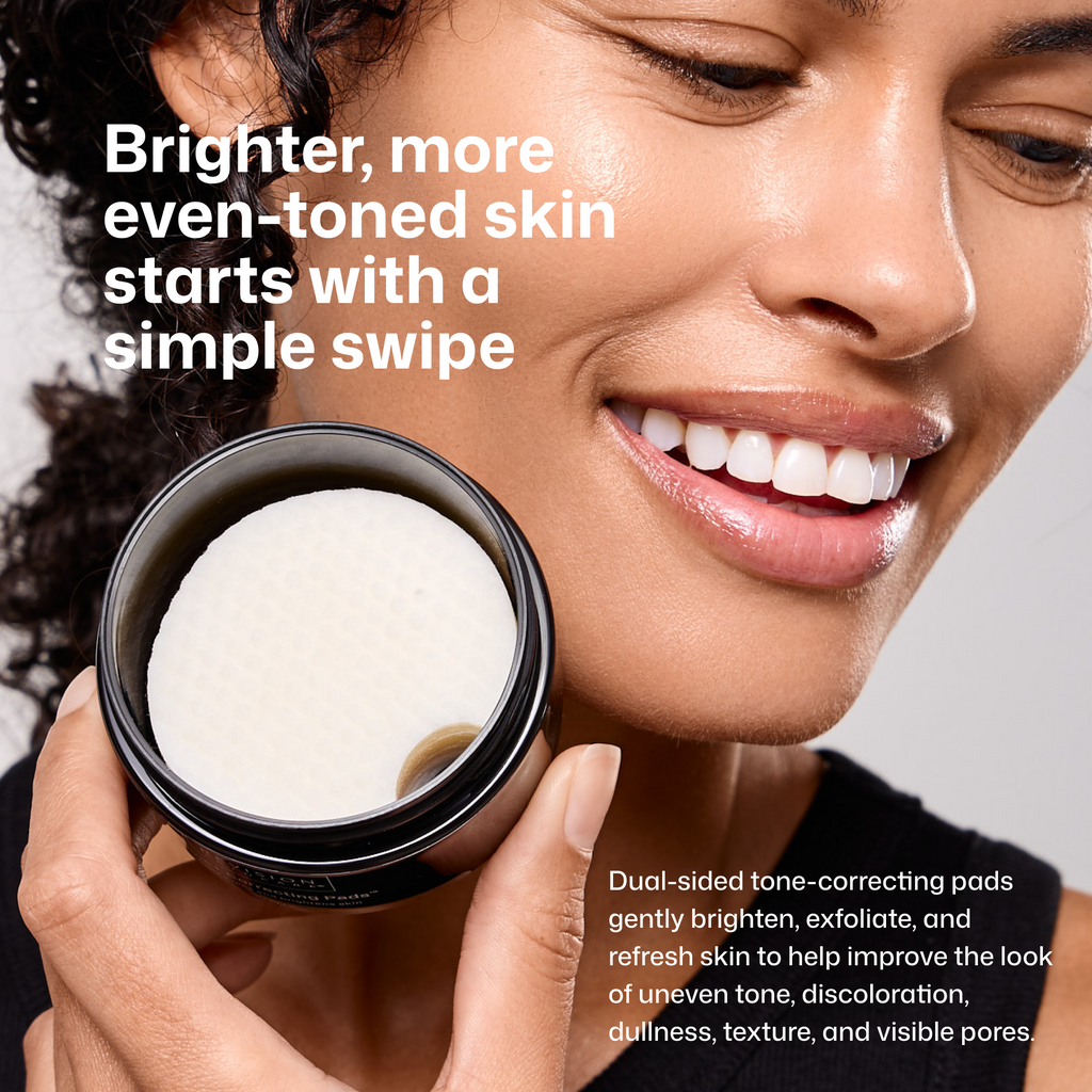 Woman's face holding a jar of tone correcting pads
