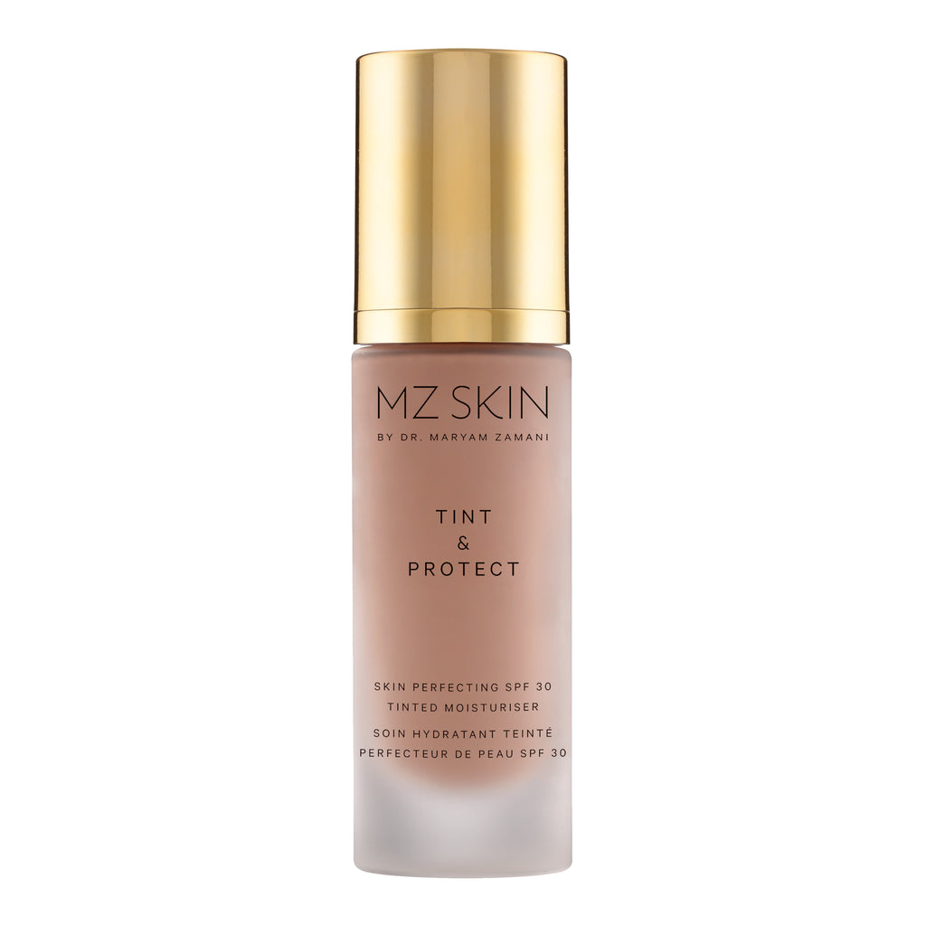 MZ SKIN Tint & Protect SPF 30 tinted moisturizer in a frosted glass bottle with a metallic gold cap, shown on a solid white background.